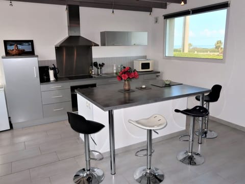 Table, Property, Furniture, Cabinetry, Lighting, Interior Design, Countertop, Flooring, Wood, Architecture