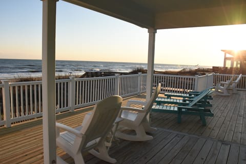 Deck overlooking and just steps from beach and ocean
