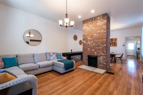 Living room with dining area and shuffle board.