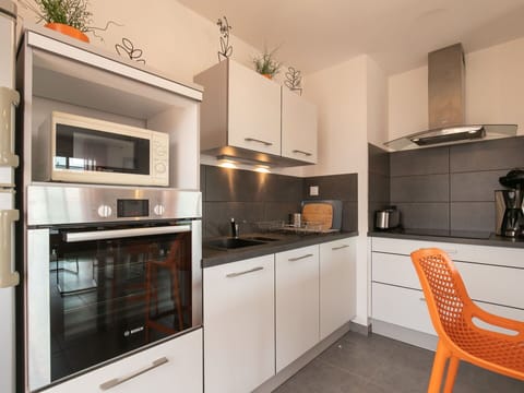 Cabinetry, Countertop, Furniture, Kitchen Appliance, Kitchen Stove, Home Appliance, Kitchen, Wood, Interior Design, Flooring