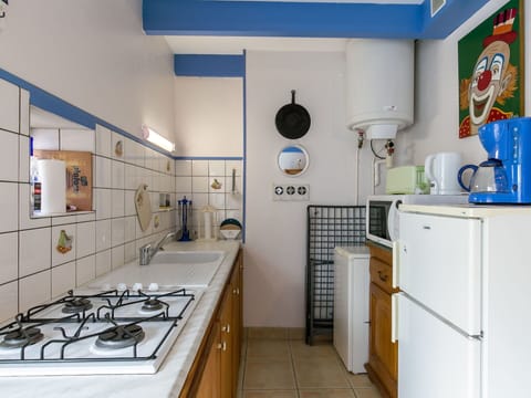 Cabinetry, Property, Blue, Kitchen, Kitchen Appliance, Interior Design, Building, Countertop, Kitchen Stove, Floor