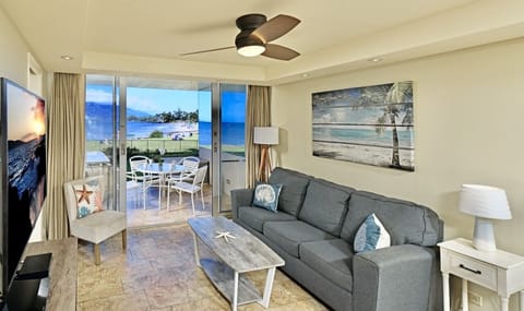 Sit back and enjoy this open airy living room with custom artwork throughout