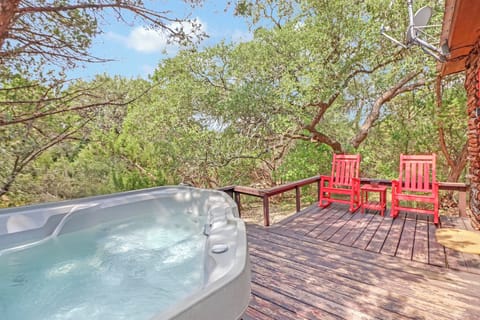 Enjoy a relaxing view from the hot tub located on the back porch