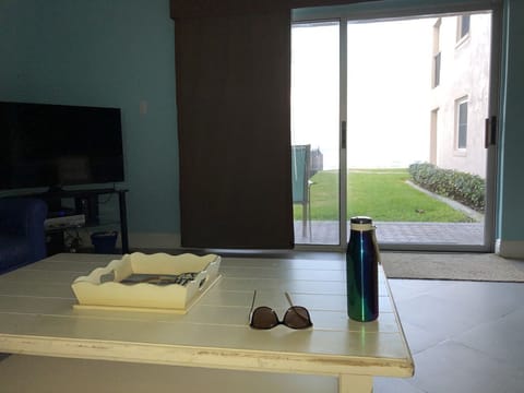 Living room view...You can see the pool and ocean from the sliding glass door!