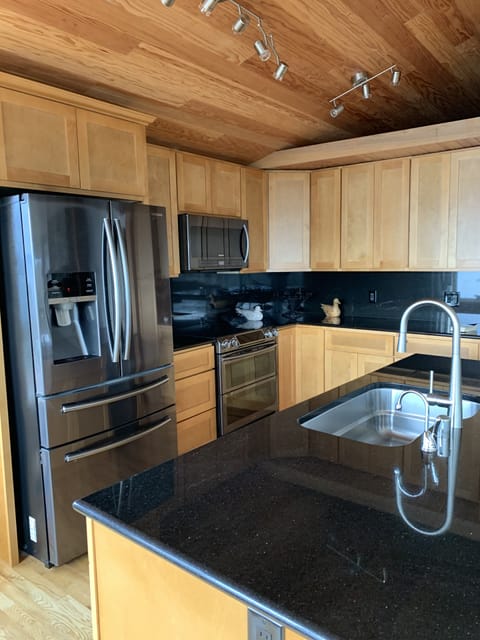 Kitchen Amenities also includes an under counter Beverage Refrigerator