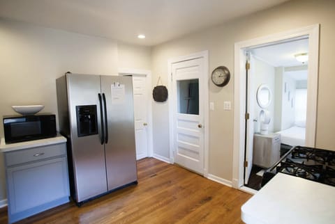 Kitchen with stove, refrigerator with icemaker and filtered water, microwave.