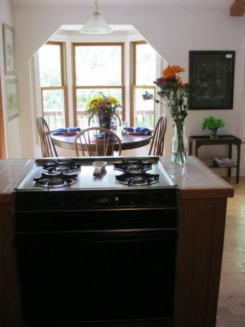 view from kitchen of dining area. open to living room