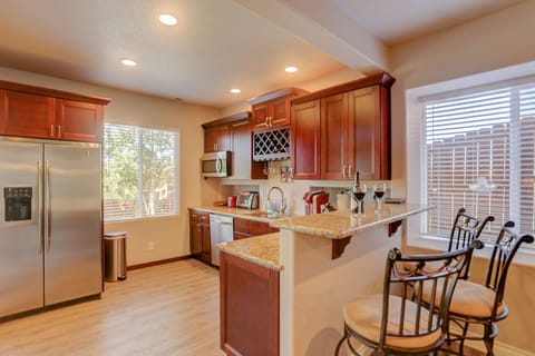 Kitchen with Breakfast Bar, Granite Counter and Stainless Steel Appliances