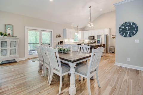 Dining table and counter seating in large new kitchen.