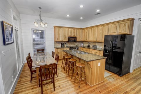 There is plenty of seating at the dining room table and extra seats at the kitchen island