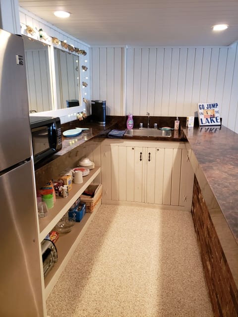 Kitchen area with all the dishes, utensils needed.