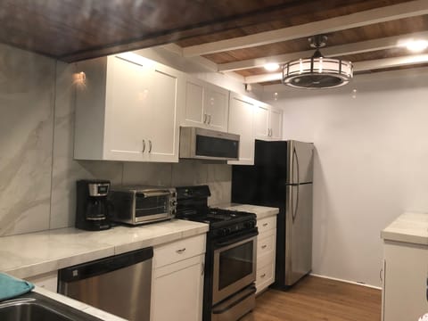 Renovated kitchen(Coffee, microwave, dishwasher, garbage disposal, watercooler).