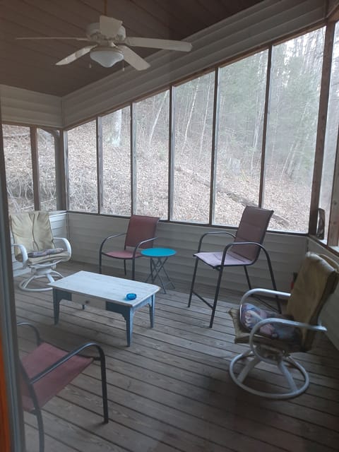 A screen in  back  porch for rainy days , coffee in the morning and cocktails .