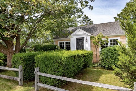 Front of house, steps to bike path, library & playground.