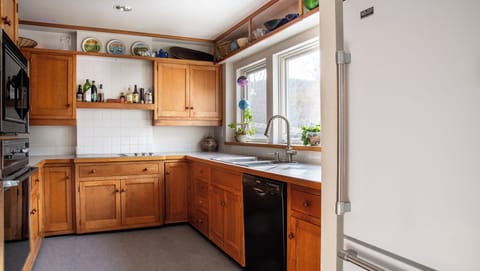 Kitchen - windows look at back yard and have view of river.
