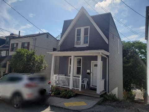 Front of the house, porch and entry.  Parking on the street and in the back.