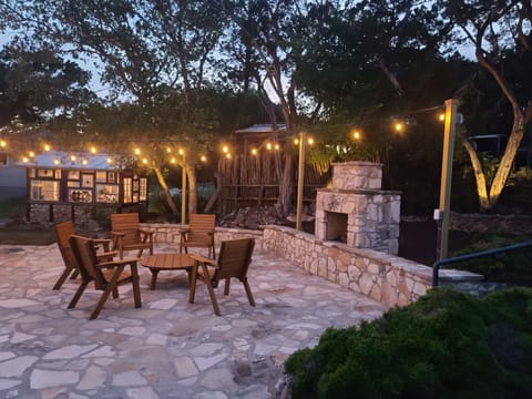 Enjoy the breezy summer nights with some wine and spirits on the stone patio.