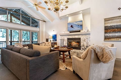 Bright welcoming living room with Gas Fireplace, flat screen TV and plenty of seating!