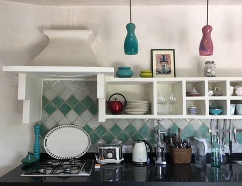 Detail of Casita kitchen with hand made glass lights