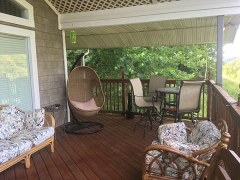 Relax in swinging chair and enjoy outdoor dining with amazing views of wildlife
