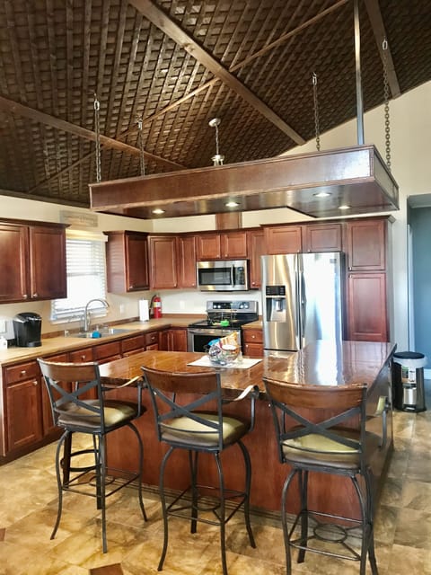 Kitchen with cherry cabinets. 3 chair bar area. Updated appliances with Keuirg