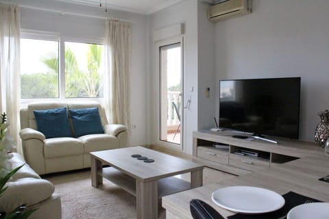 Spacious Living Room with UK TV