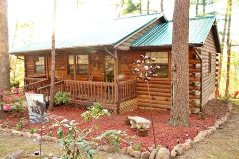 Swing and two rocking chairs on front porch.
