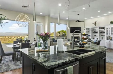 Charming seating nook connects the dining and living spaces, with scenic views