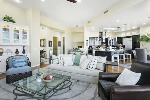 Relax in the large living area featuring a smart TV and comfortable seating
