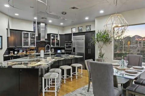 "Open layout connects the kitchen and dining area, easy to cook, serve, & enjoy