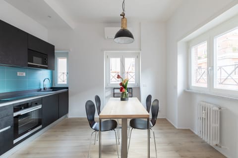 Bright, spacious, and furnished kitchen and iving room .