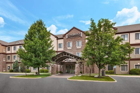 Arrive at your home away from home, framed by lush greenery and inviting architecture.