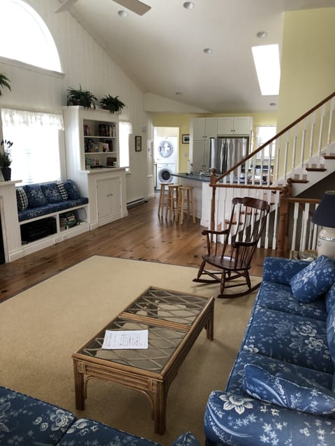 Living area/stairs up & down to bedrooms