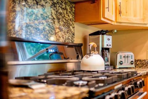 Fully equipped kitchen to make meals at home, including a 6-burner gas stove. 