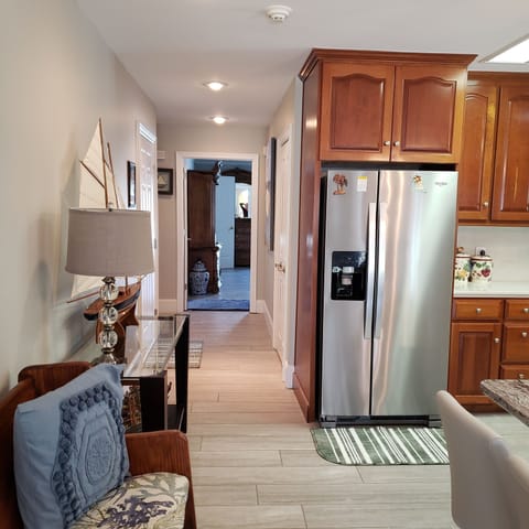 Stainless steel side by side refrigerator in main kitchen.
