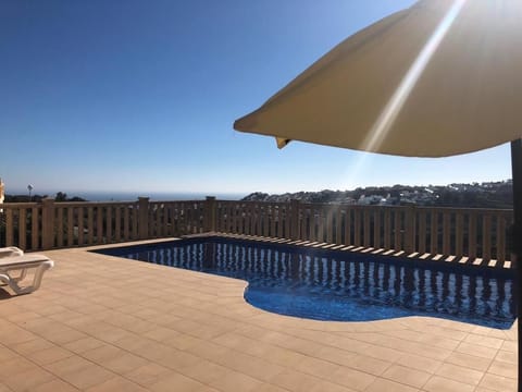 Beautiful view from the terrace across the pool and out to sea 