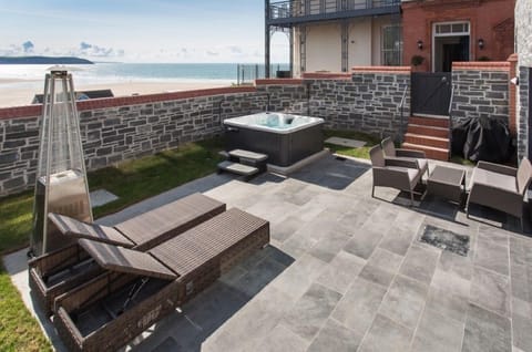 View over the private terrace with hot tub to Woolacombe Beach