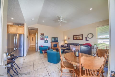 Open kitchen/dining/living room with many extra amenities.