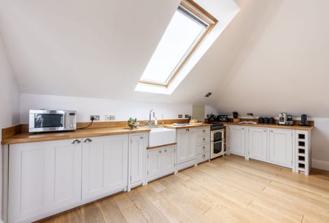 9 Fernhill Penthouse, Carbis Bay. Gorgeous open-plan kitchen with oven and hob, dishwasher, fridge, freezer, microwave and Nespresso coffee machine