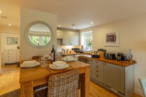 6 Sandy Lane, Carbis Bay. First floor: The shaker style kitchen with a view to the master bedroom