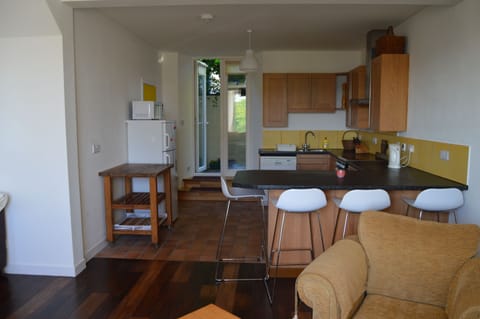 The open plan kitchen diner with a door to the rear garden.