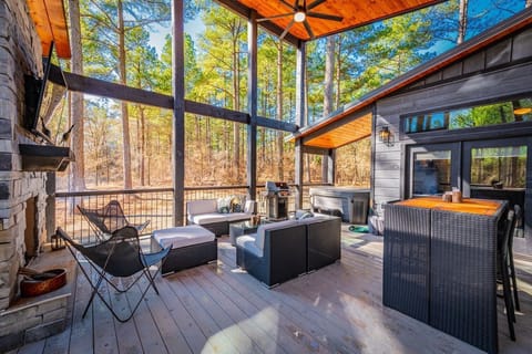 Relax in the private hot tub surrounded by the peaceful pine forest of Hochatown.