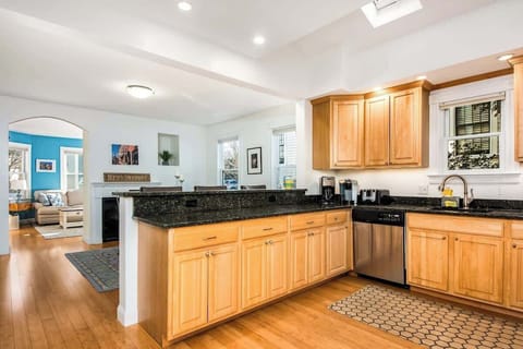The open concept dining room and kitchen offers an abundance of space for several cooks in the kitchen and friends and family to dine. (Keurig coffee maker not available)