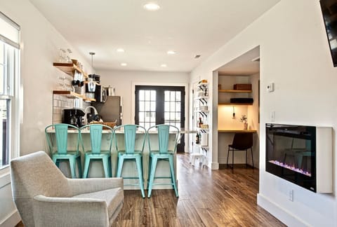 Open floor plan with Farmhouse American-minimalist design.