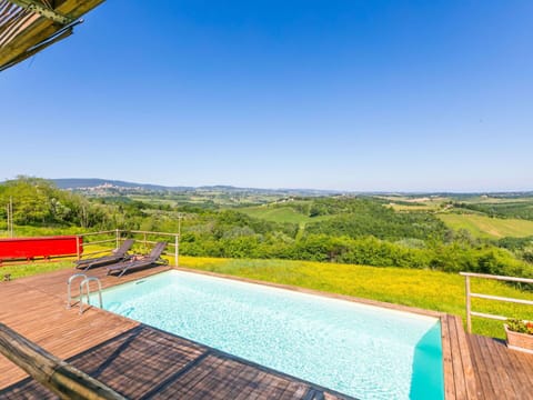 Sky, Water, Property, Plant, Swimming Pool, Azure, Building, Outdoor Furniture, Natural Landscape, Tree