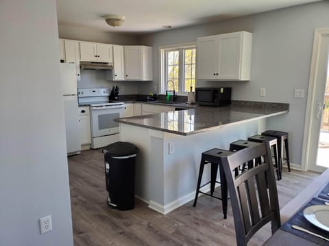 Newly Renovated kitchen.  Fully stocked with pots/pans and dishes.