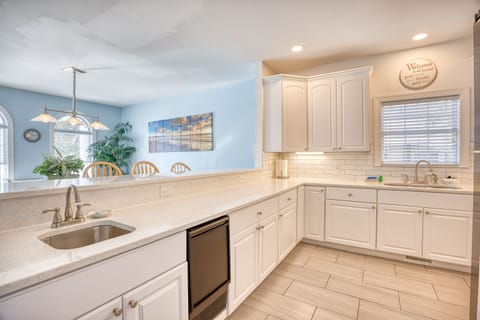 Kitchen overlooks dining area. Pictured next to the 2nd sink is a 2nd ice maker