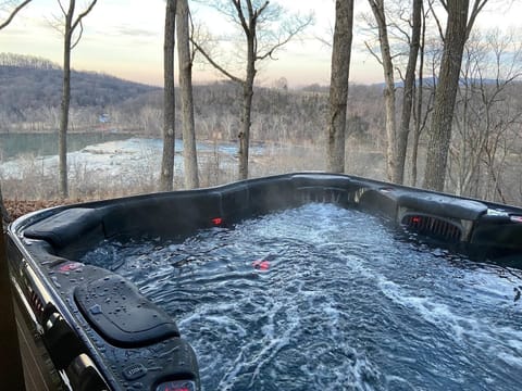 Soak in the tub while enjoying the beautiful view of the river below!