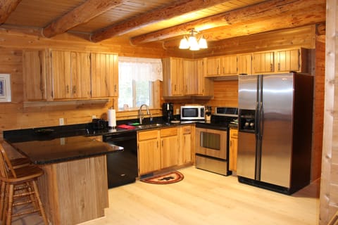 Fully appointed kitchen with granite & stainless appliances