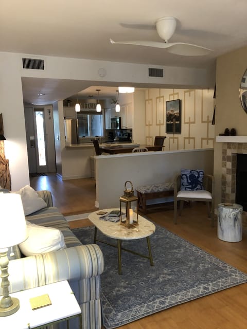 Living room with dining room and kitchen in the background.